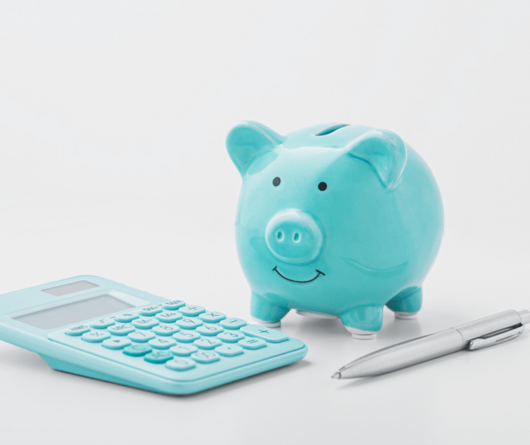 Teal piggy bank and a calculator